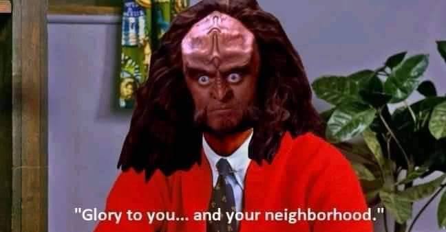 This meme is an image of the character Worf from the TV show Star Trek: The Next Generation, dressed in a suit and tie, with a stern expression. The text overlaid on the image reads "Worf: 'Today, I will speak to the Federation about your planet's lack of... (pauses) ... parking.'".